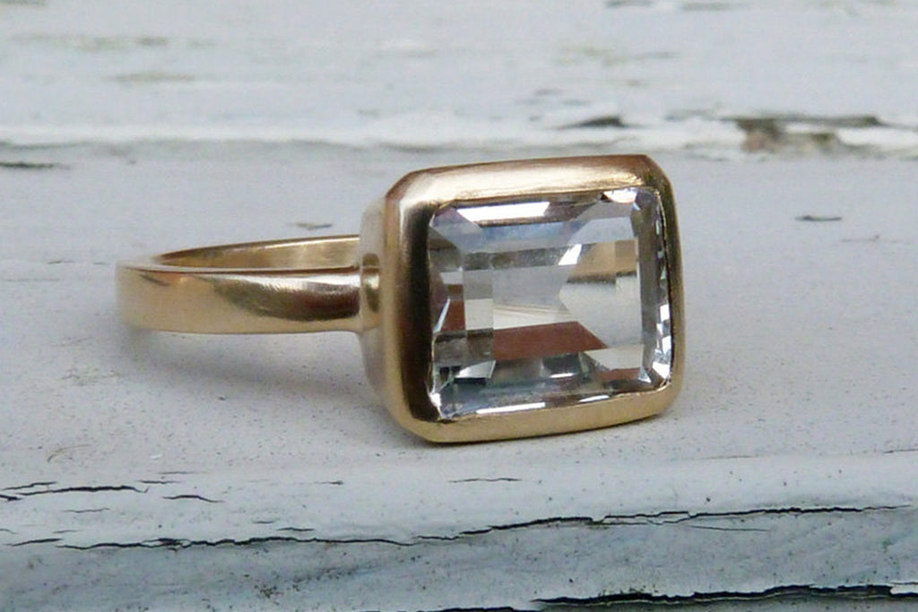 Gold, white topaz engagement ring