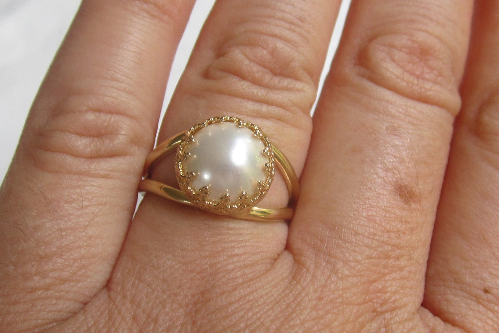 white pearl in gold ring