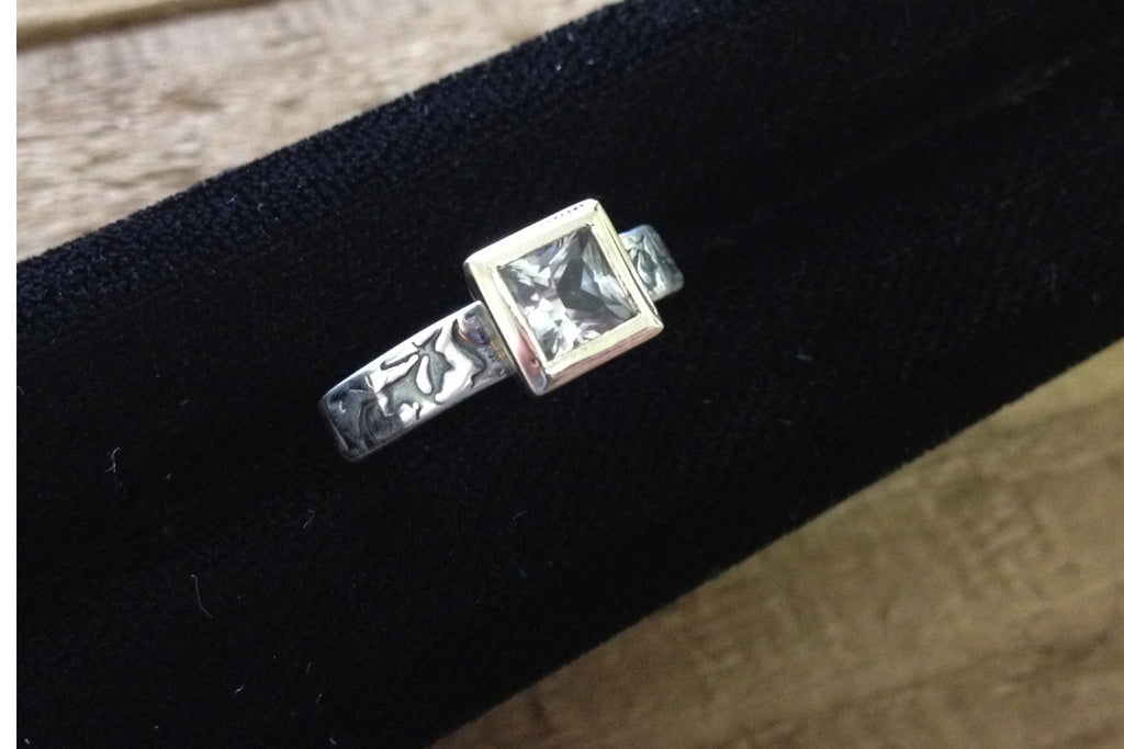 Princess cut white sapphire engagement ring