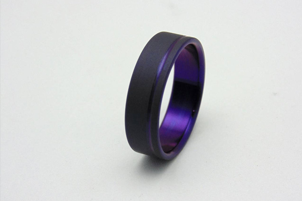 Titanium ring with plum crazy purple pinstripe