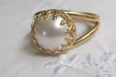 white pearl in gold ring