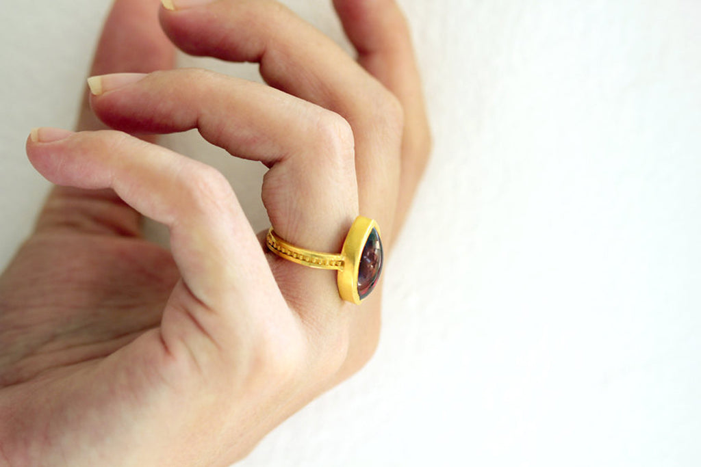 Marquise cut red stone ring