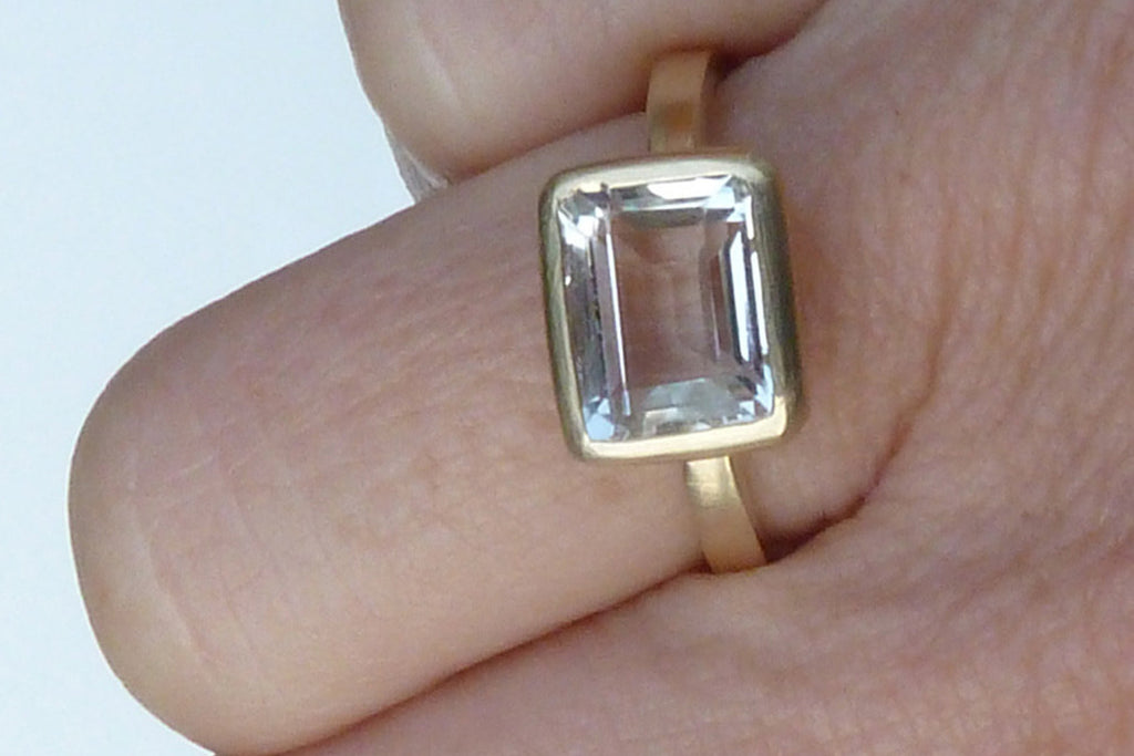 Gold, white topaz engagement ring