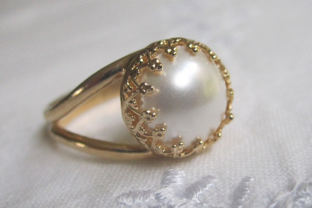 white pearl in gold ring