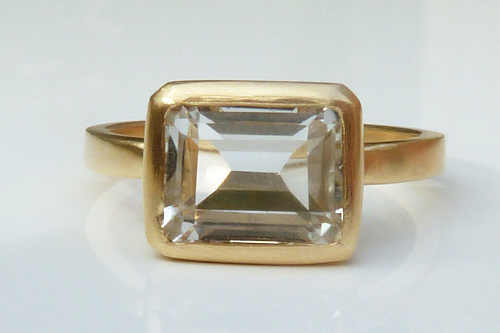 Gold, white topaz engagement ring