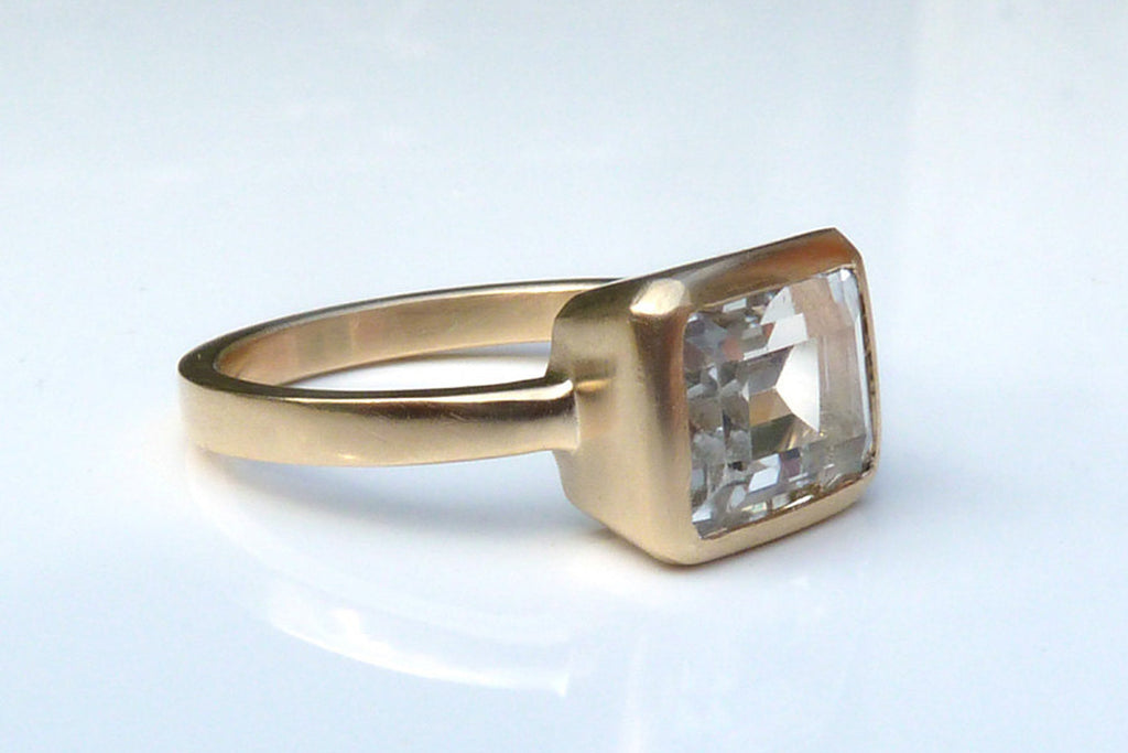 Gold, white topaz engagement ring