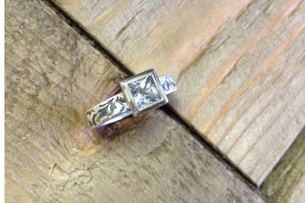Princess cut white sapphire engagement ring