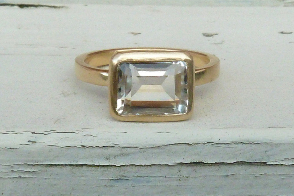 Gold, white topaz engagement ring