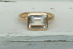 Gold, white topaz engagement ring