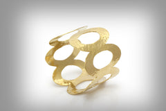 Wide hammered gold bracelet